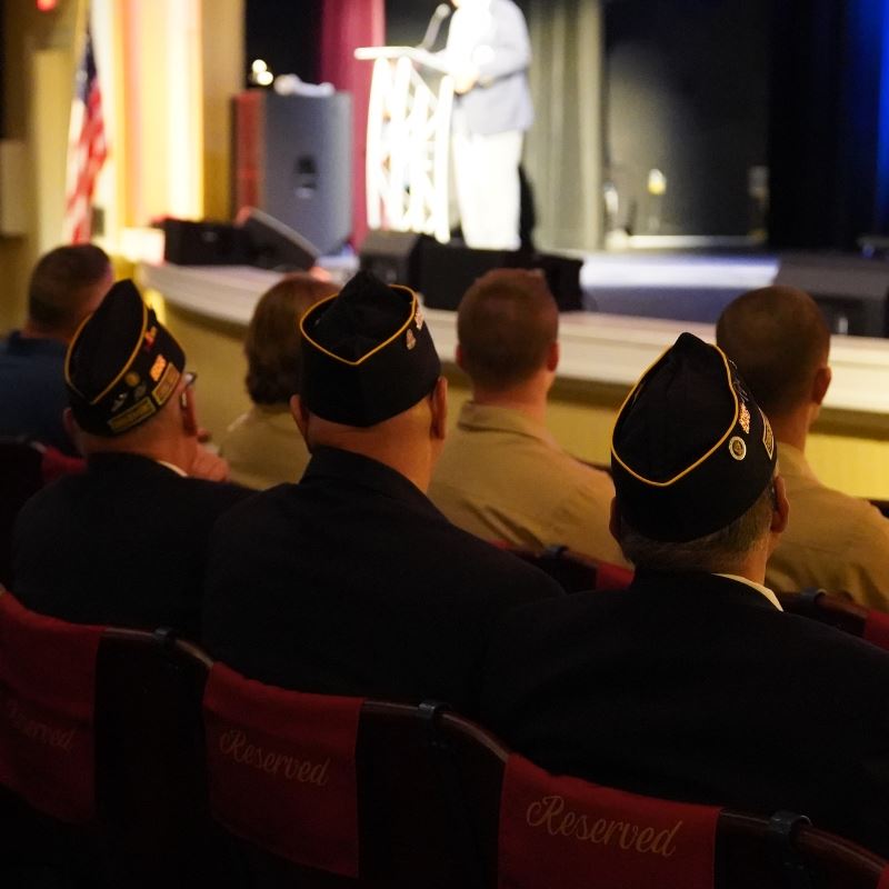 Veterans sit in Clayton Center auditorium and listen to speaker